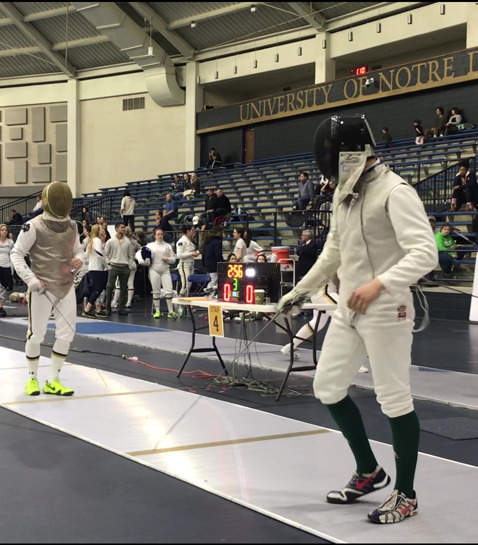Ethan fencing on strip against Notre Dame